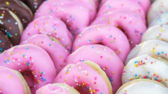 Multi colored donuts small pieces for party.